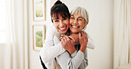 Hug, portrait and woman with senior parent in home for bonding, relationship or visit. Care, love and smile of adult daughter embracing mother in apartment together for connection or retirement