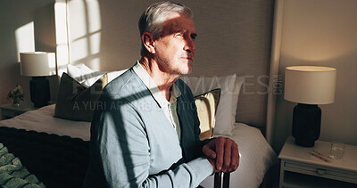 Buy stock photo Thinking, cane and senior man in bedroom for wellness, balance or support for arthritis recovery. Sunshine, walking stick and old person with a disability for mobility aid or reflection in home