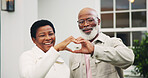 New house, smile and couple with heart hands, love sign and support with property investment. Mature black people, portrait and care gesture with security, real estate and connection at backyard