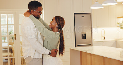 Buy stock photo Dancing, smile and couple in kitchen at house with music for bonding, love and connection together. Happy, marriage and black man with woman for moving to romantic playlist on weekend in apartment.
