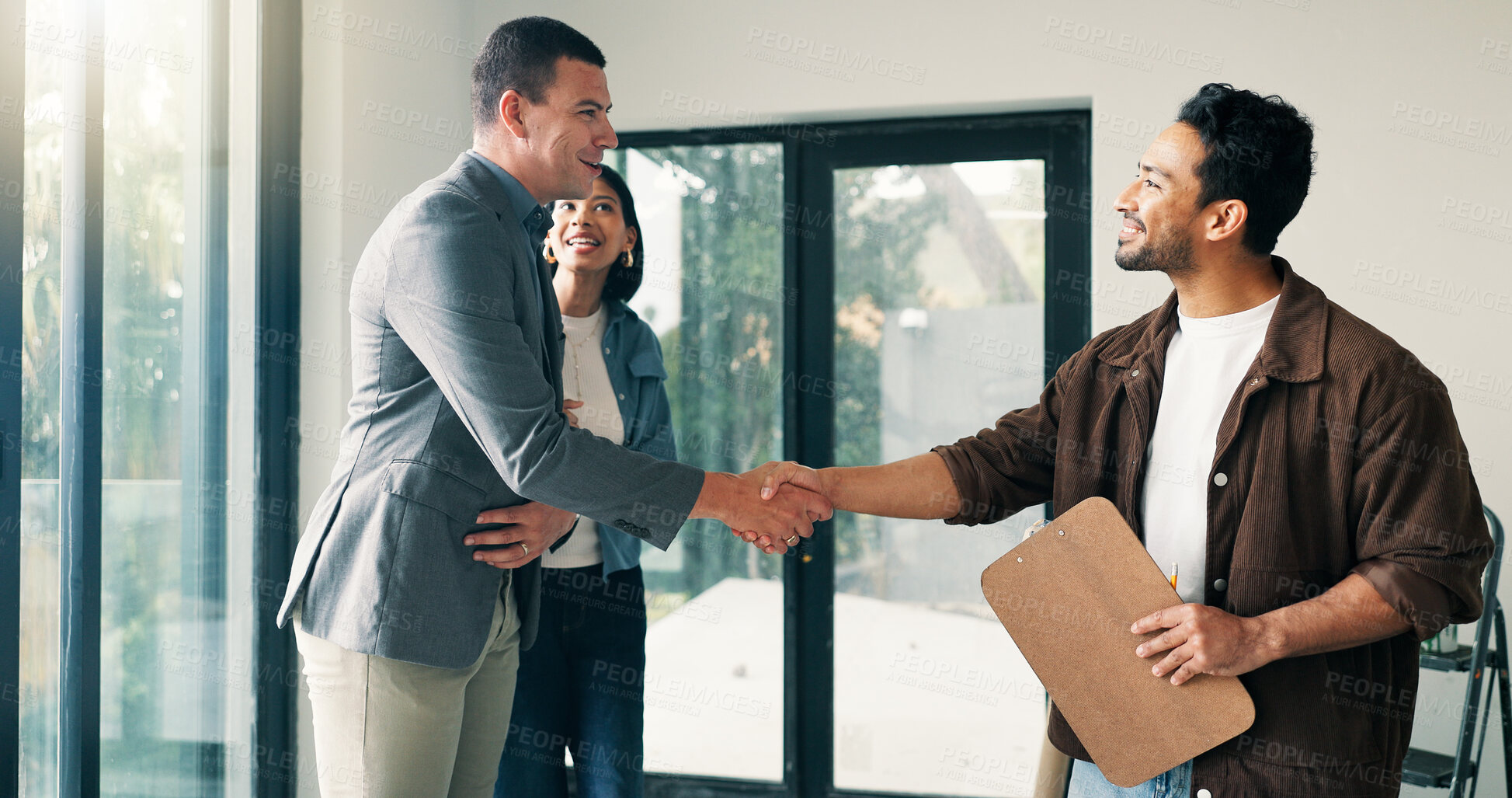 Buy stock photo Couple, handshake and renovation with contractor in new house for agreement and contract. Deal, home improvement and shaking hands with happy people in real estate development for maintenance