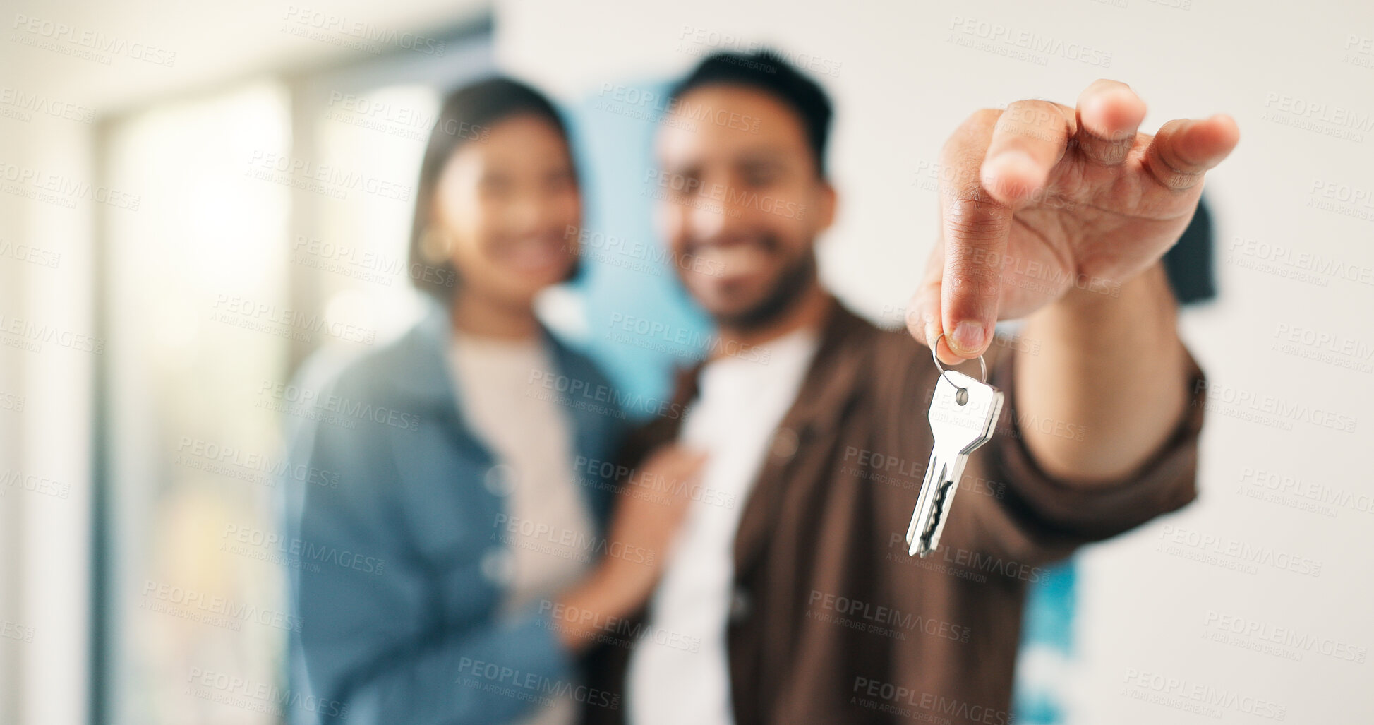 Buy stock photo Real estate, couple and hand in home with key, investment and fresh start with house remodeling. Property, renovation or people with purchase, housing success or moving achievement for new homeowners