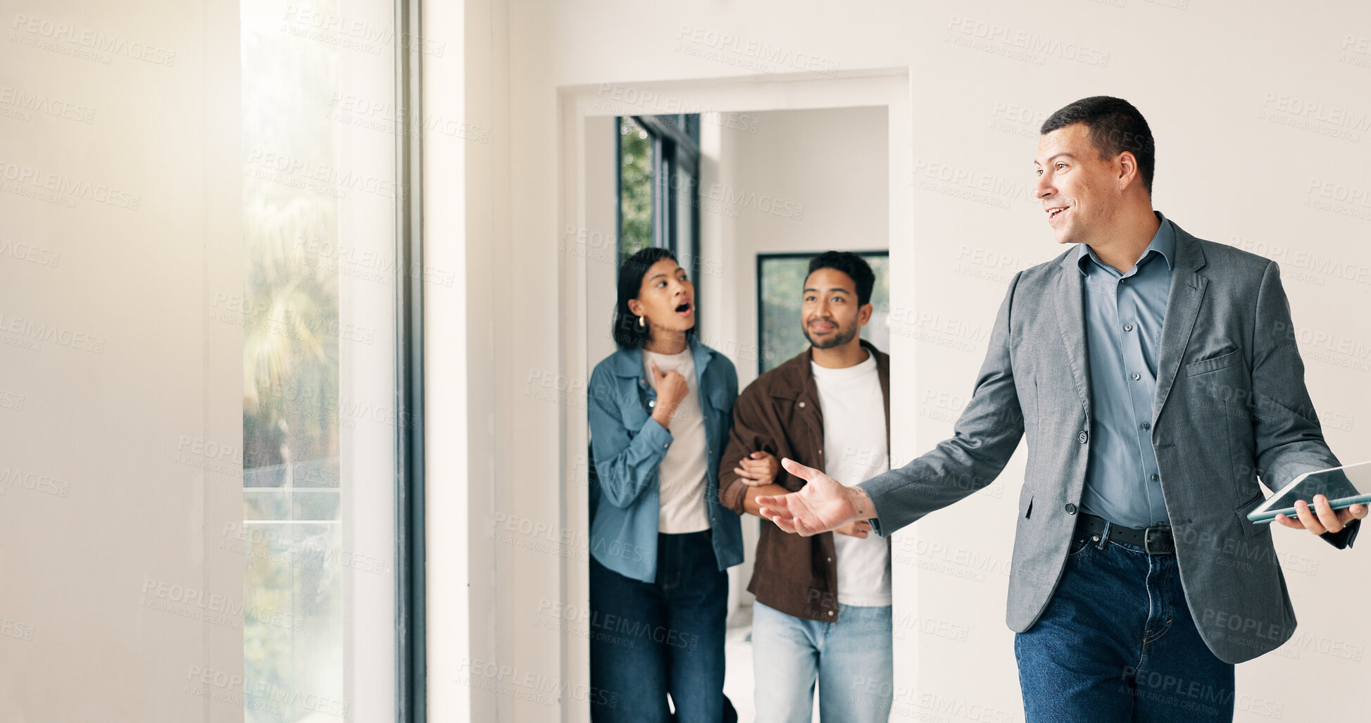 Buy stock photo Couple, relocation and surprise with realtor in new home for opportunity, sale or viewing. Bond approval, mortgage loan and showing with shocked people in real estate development for purchase