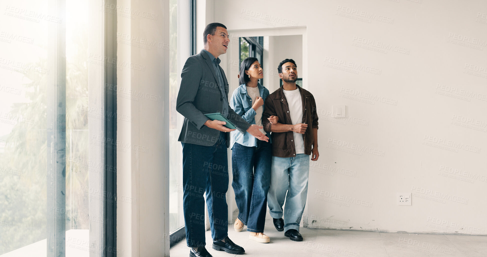 Buy stock photo Couple, relocation and tour with realtor in new home for opportunity, sale or viewing. People, mortgage loan and property buyer with bond in real estate space for development, inspection or purchase