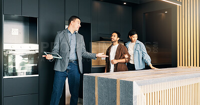 Buy stock photo Couple, relocation and showing with realtor in new home for opportunity, sale or viewing. Bond, kitchen inspection and mortgage loan with people in real estate development for purchase options