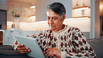 Smile, woman and relax in home with tablet, social media and download bingo for weekend break. Happy, mature person and browsing at house with digital, reading ebook and subscription for online games