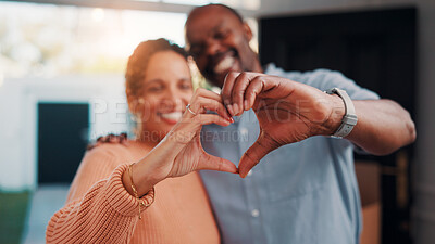 Buy stock photo Heart hands, happy and couple in home with support, bonding and connection in marriage on date. Smile, emoji and African man with woman for love gesture with commitment, trust or relationship.