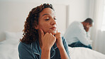 Angry, couple and woman with depression in bedroom, thinking and fight with partner on bed in house. Mature African people, reflection and contemplating divorce in home, marriage crisis and conflict