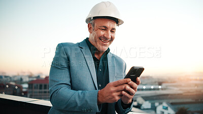 Buy stock photo Typing, man and architect with phone, sunset and engineering for urban infrastructure outdoor. Communication, mature person and contractor on rooftop with tech, quality control or city construction