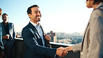 Balcony, meeting and business people in city with handshake, property management agreement and deal. Happy, man and shaking hands outdoor with real estate agent, partnership and urban development.