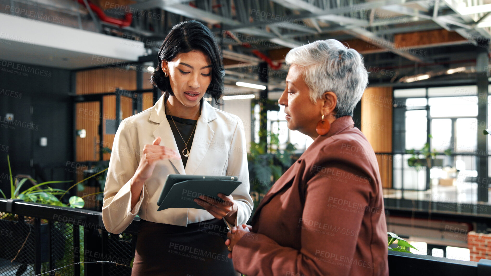 Buy stock photo Discussion, tablet and woman with manager in office for planning, meeting and update on finance report. Corporate, lobby and business women on tech for financial review, feedback or advice for budget