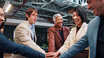 Happy, solidarity and business people with stack of hands in office for good news on legal case. Circle, win and team of corporate attorneys with collaboration, celebration or support for law project