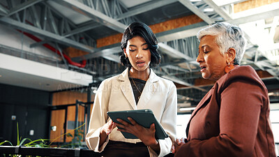 Buy stock photo review, tablet and talking with business women in office together for feedback, report or update. App, collaboration and conversation with employee people in workplace for planning or research