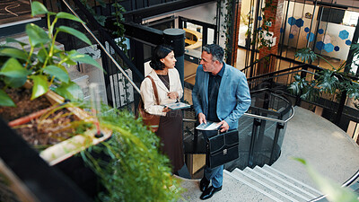 Buy stock photo Above, manager and woman with tablet on stairs for financial forecasting with market research in office. Economist, advice and collaboration for business strategy, chat and people with tech on steps