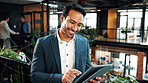 Man, reading and tablet in office with sustainable business, research or happy with ESG compliance. Coworking, person and online in eco friendly company with tech, smile or audit for carbon footprint