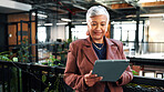 Woman, research and tablet in office with sustainable business, reading ESG report and planning. Manager, mature person and browse with tech, eco friendly company or environmentalist review SDG goals