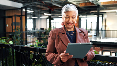 Buy stock photo Woman, research and tablet in office with sustainable business, reading ESG report and planning. Manager, mature person and browse with tech, eco friendly company or environmentalist review SDG goals