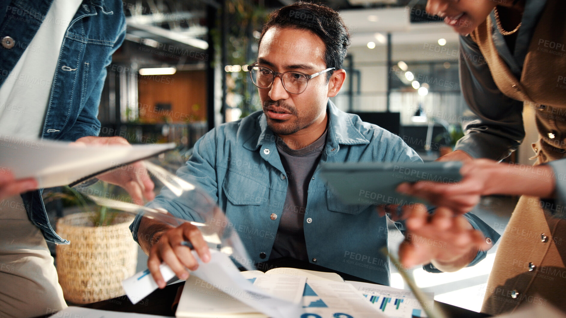 Buy stock photo Chaos, multitask and businessman with team, stress or overworked with analysis documents. Pressure, overwhelmed and person in creative office with tablet, productivity charts and deadline crisis