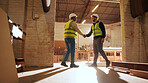 Carpenter, men and shaking hands in factory for welcome, manufacturing collaboration or deal. Woodwork, agreement or handshake with people in workshop for greeting, joinery production and partnership