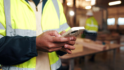 Buy stock photo Carpenter, hands and person with phone in factory for manufacturing, check stock or online order. Mobile, woodwork and artisan with joinery production, typing email and lumber inventory for supply