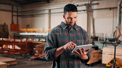 Buy stock photo Man, tablet and scroll in woodworking workshop, check lumber order or online inventory management. Carpenter, smile and reading on tech for digital stock analysis or search carpentry merchandise app