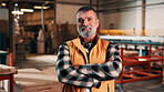 Carpentry, portrait and man in factory with arms crossed, handyman or pride in manufacturing industry. Smile, ambition or mature artisan with about us, production career or confidence in woodworking.