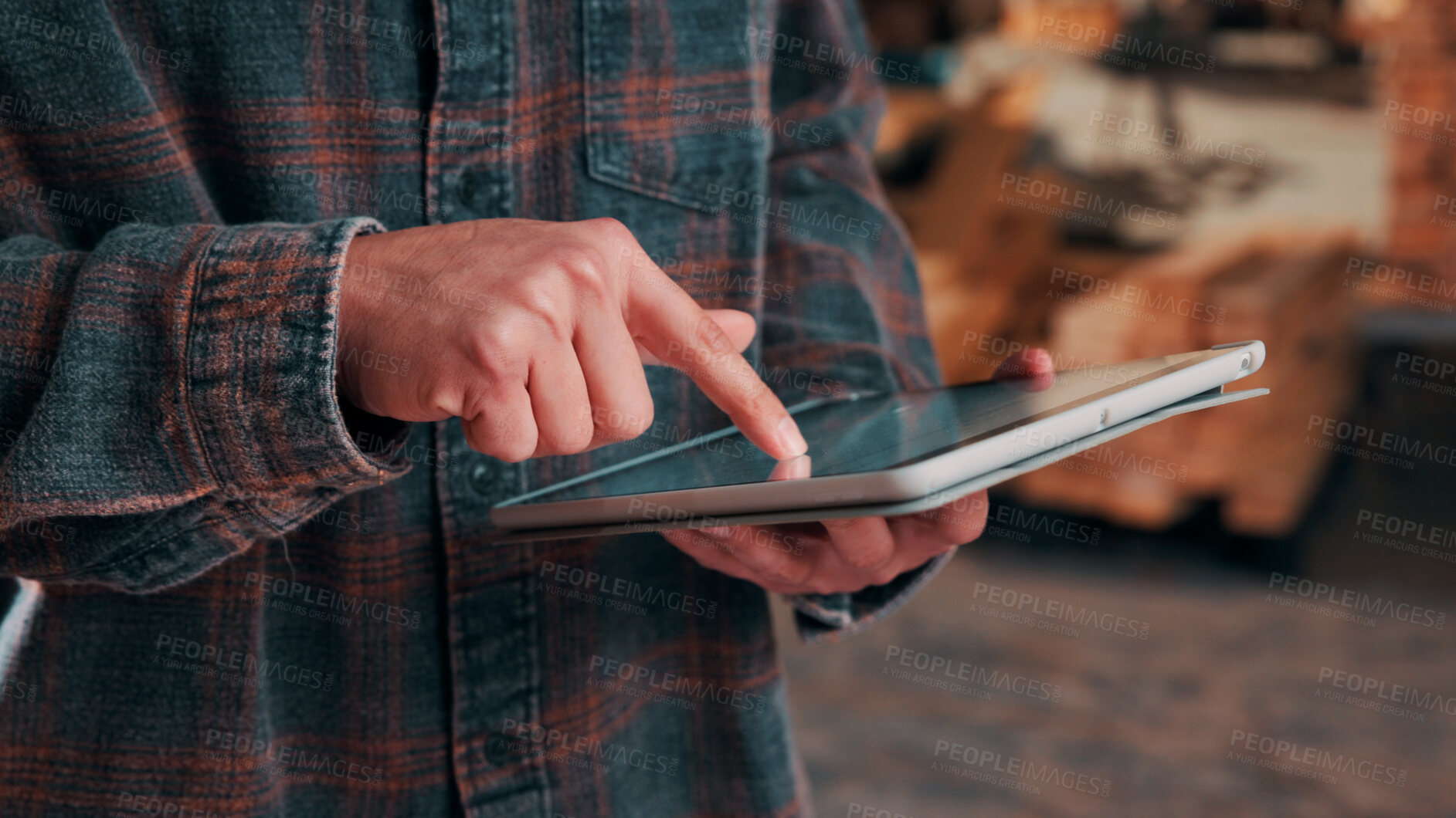 Buy stock photo Hands, tablet and scroll in carpentry workshop, check lumber order or online inventory management. Person, carpenter and tech for digital stock analysis or search woodworking merchandise app for info