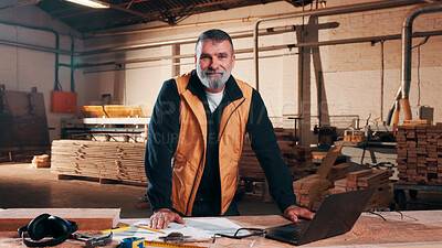 Buy stock photo Carpenter, portrait and man on laptop in workshop for planning, schedule or manufacturing quote. Warehouse, mature person or carpentry with tech for woodwork or furniture production with smile