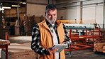 Man, tablet and scroll in carpentry factory, check lumber order or online inventory management. Mature, carpenter and tech for digital stock analysis or search woodworking merchandise app for info