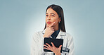 Tablet, thinking and scientist in studio with medical research, innovation or pharmaceutical report. Technology, woman and biologist with ideas for science project for healthcare on blue background.