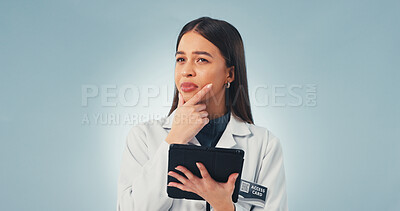 Buy stock photo Tablet, thinking and scientist in studio with medical research, innovation or pharmaceutical report. Tech, woman and biologist with ideas for science study, healthcare or space on blue background.