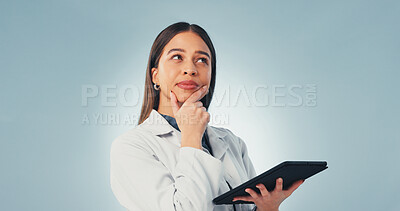 Buy stock photo Tablet, thinking and scientist in studio with medical research, innovation or pharmaceutical report. Tech, woman and space with ideas for science study, healthcare or planning on blue background.