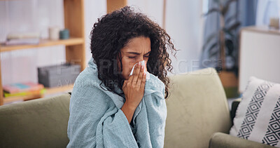 Buy stock photo Blanket, woman and sick with sneeze in home for seasonal allergies, fatigue and respiratory virus. Recovery, fever and unwell person with runny nose on sofa from influenza, viral infection and sinus