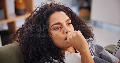 Buy stock photo Woman, biting nails and stress on sofa in home with worry, mental health crisis and frustrated. Psychology, person with depression and tension with anxiety, trauma and fear on couch in living room