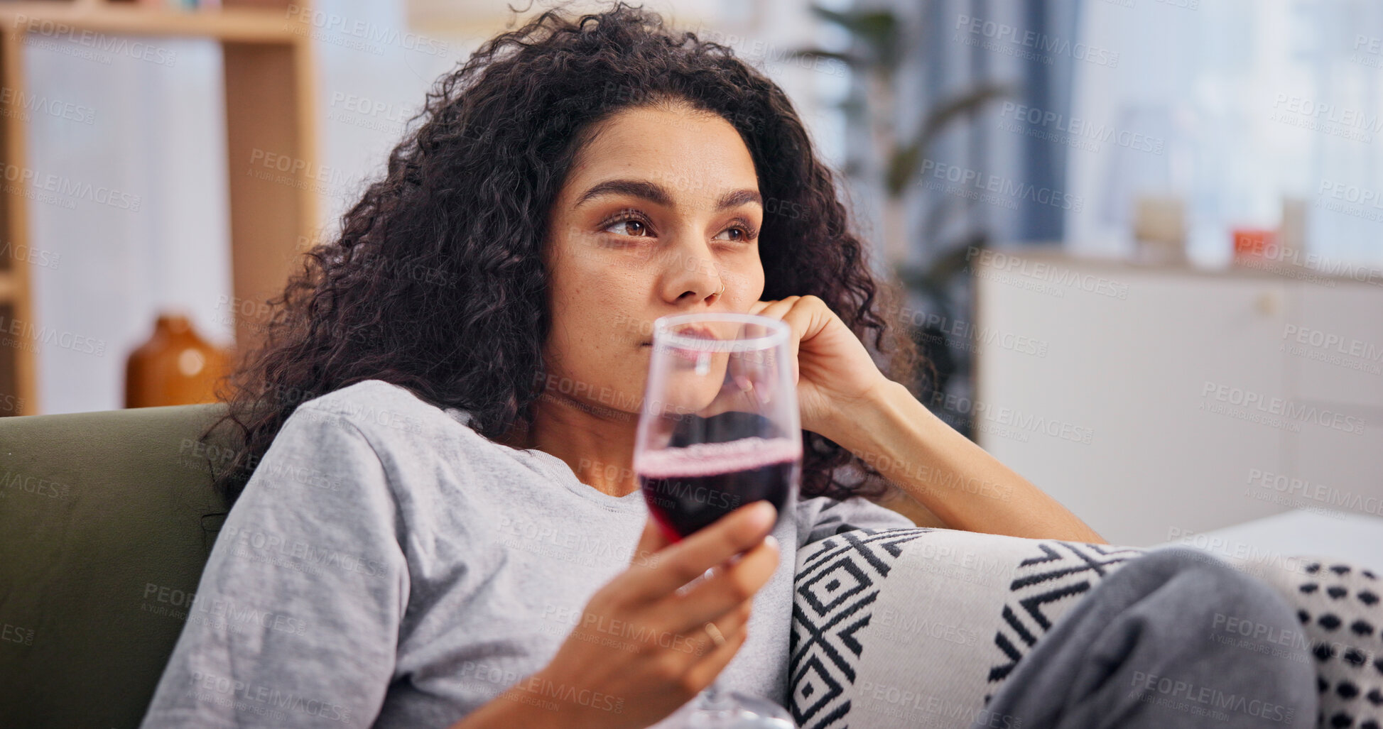Buy stock photo Woman, wine and sad on sofa in home with alcohol addiction, mental health crisis and thinking. Psychology, person with depression and worry with hangover, trauma and drinking regret in living room