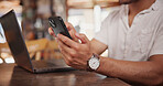 Laptop, research and hands with phone in cafe, copywriting and freelance assignment on social media. Copywriter, online and person with technology, remote work and email marketing with mobile in shop