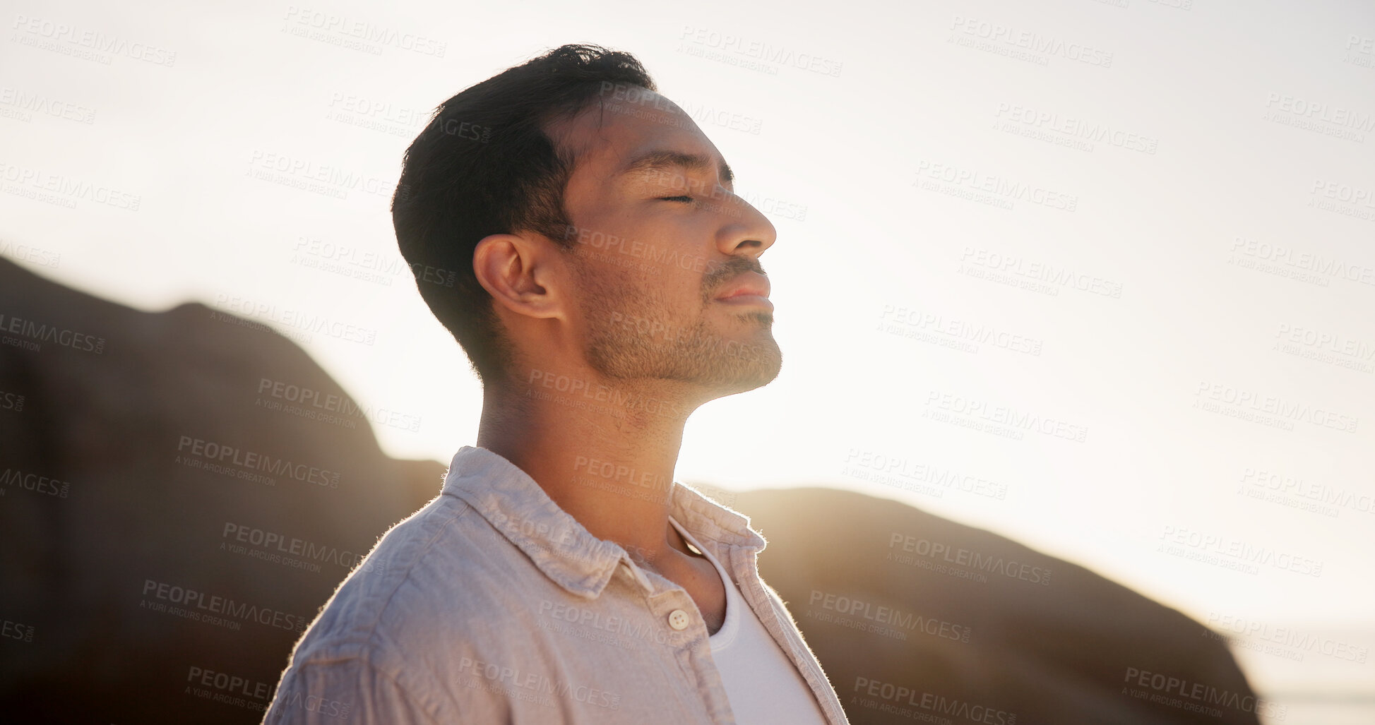 Buy stock photo Man, mindfulness or breathing at beach for calm, wellness and summer vacation with flare. Space, peace and person by sea with meditation, nature and awareness mindset with travel to coast for sunrise