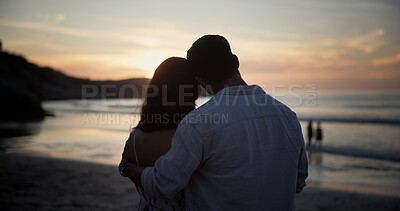 Buy stock photo Back, couple and hug at beach for travel, sightseeing and romantic date on holiday getaway. Sunset, people and embrace at seashore with partner, commitment and tropical vacation for adventure trip