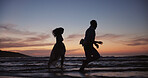 Silhouette, couple and running at beach for travel, journey and romantic date on holiday. Space, sunset and people at seashore with happiness, commitment and tropical vacation for adventure getaway