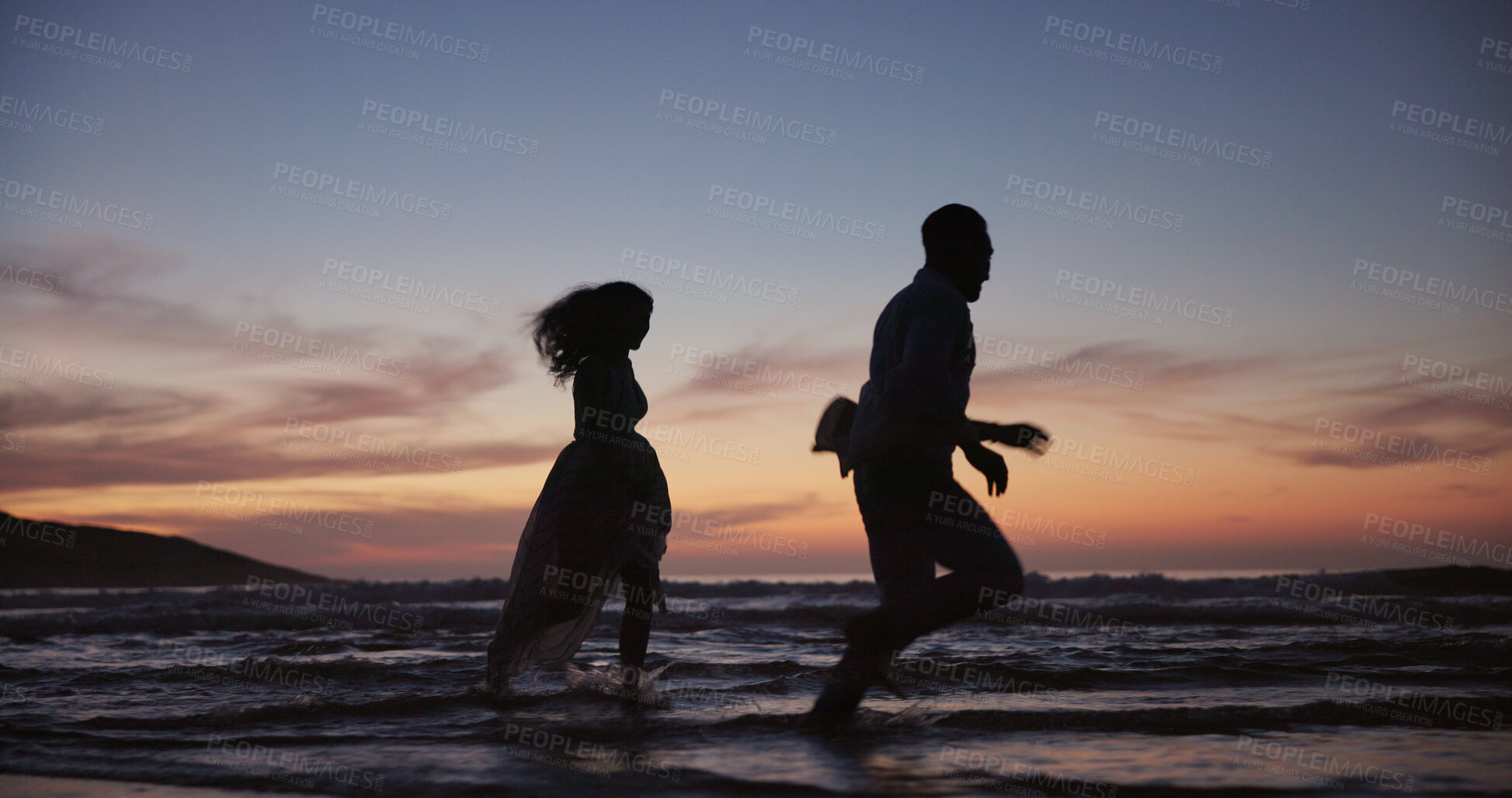 Buy stock photo Silhouette, couple and running at beach for travel, journey and romantic date on holiday. Space, sunset and people at seashore with happiness, commitment and tropical vacation for adventure getaway