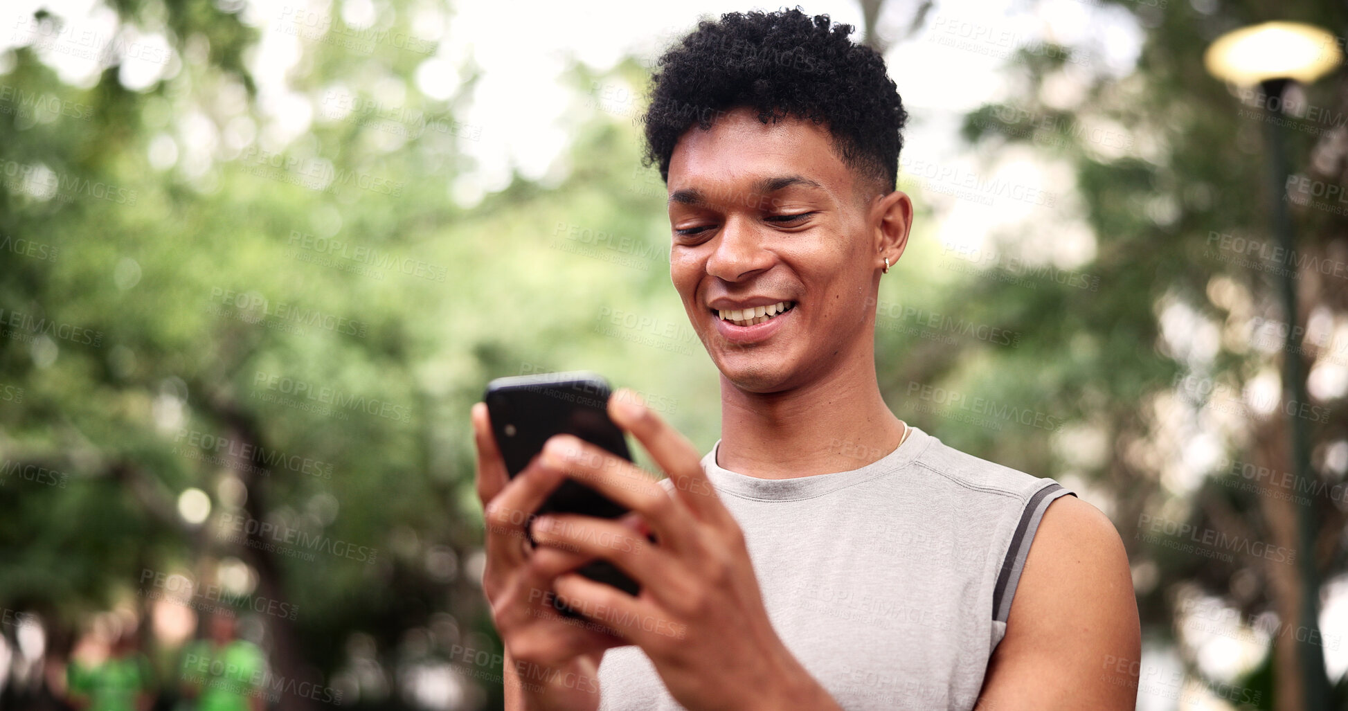 Buy stock photo Outdoor, fitness and man with phone, online and texting with smile on social media or communication. Happy, athlete and person with mobile for chat, networking and workout update on website in nature