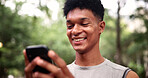 Outdoor, fitness and man with phone, reading and texting with smile on social media or communication. Happy, athlete and person with mobile for chat, network and workout update on website in nature