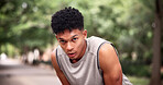 Tired, portrait and man at park, fitness and breathing after physical activity or exhausted on break. Runner, fatigue and workout recovery in nature, rest and person with sweat or wellness on weekend