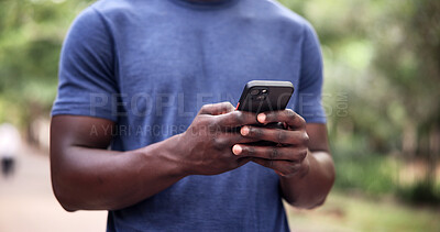 Buy stock photo Outdoor, fitness and hands with phone, chatting and texting on website or communication with contact. Athlete, scroll and person with mobile, networking and workout update on social media at park