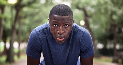 Buy stock photo Tired, portrait and man on break, fitness and breathing after physical activity or exhausted at park. Runner, fatigue and workout recovery in nature, rest and black person with sweat and wellness