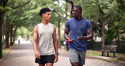 Buy stock photo Friends, walk and men at park, fitness and workout routine for health in nature or physical activity. Outdoor, athlete and happy people on road, talking and exercise together for wellness and active