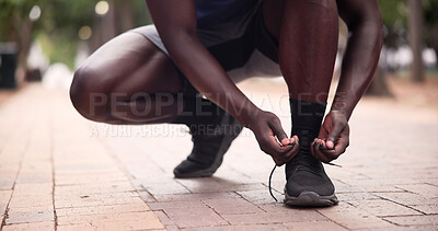 Buy stock photo Fitness, person and hands tying shoes in park for running preparation or outdoor workout. Active runner, legs or getting ready with sneakers, tie or laces for training, exercise or sprint in nature
