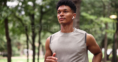 Buy stock photo Running, fitness and man with earphones for exercise, serious or physical activity with subscription. Outdoor, athlete and person with technology for workout, endurance and listening to music at park