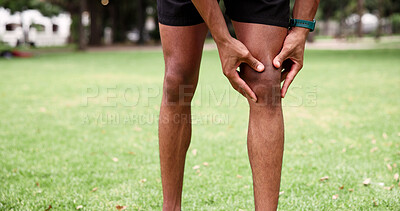 Buy stock photo Park, man and knee pain with hands, fitness and grass field for exercise and workout with muscle tension. Person, athlete and runner with outdoor accident, overworked joint and burnout from training