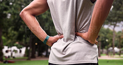 Buy stock photo Back pain, runner and hands of man in nature for training fatigue, athlete accident and muscle strain. Massage, inflammation and sports injury with person outdoor for workout, pressure and tension